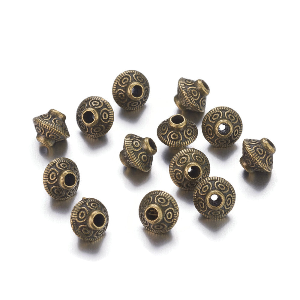 10 perles intercalaires bicônes tibétaines 6mm