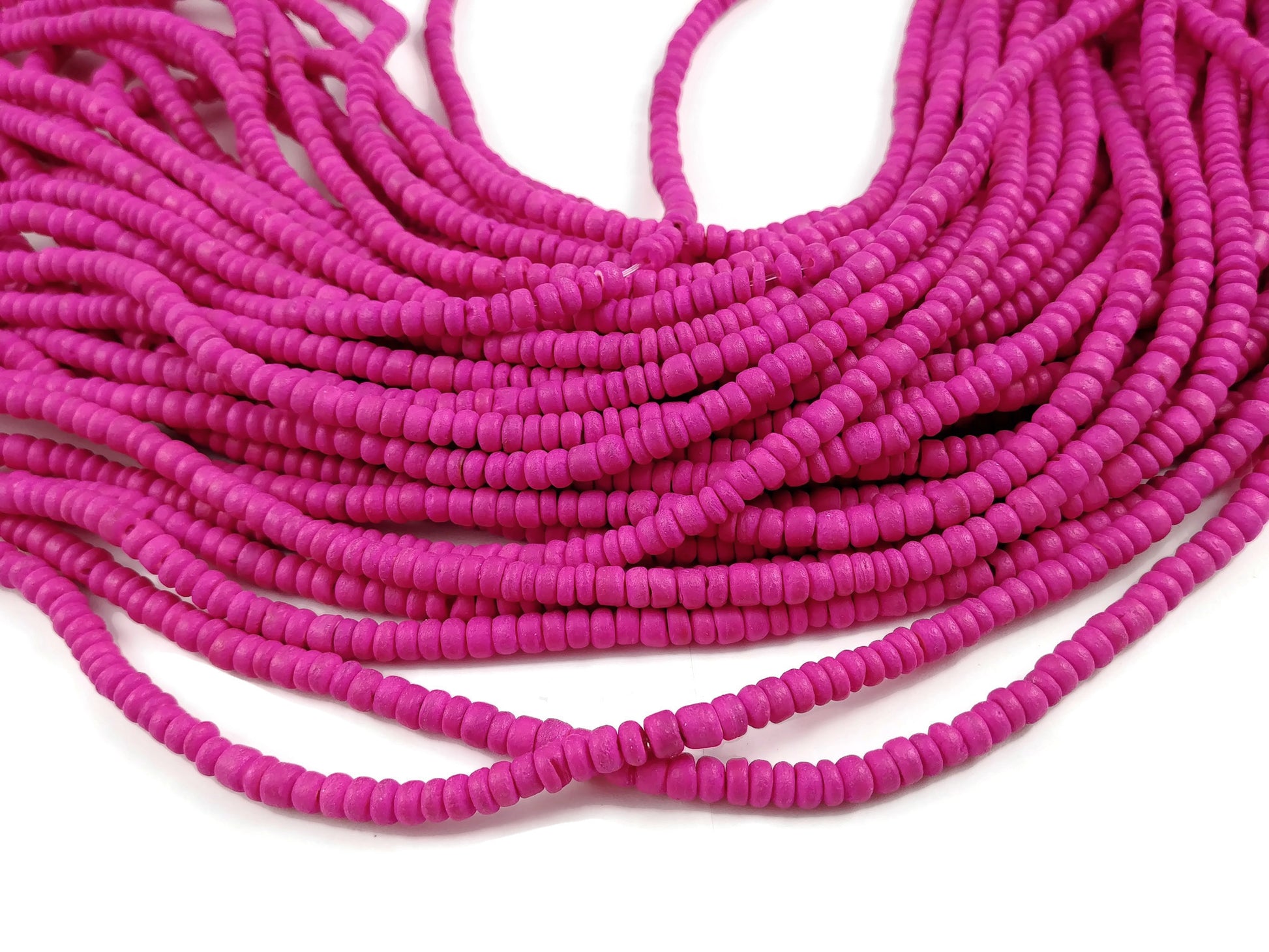Perles de bois de coco rose fushia en rondelle de 4-5mm