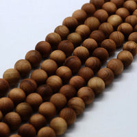 Perles rondes en bois doré 6 ou 8mm